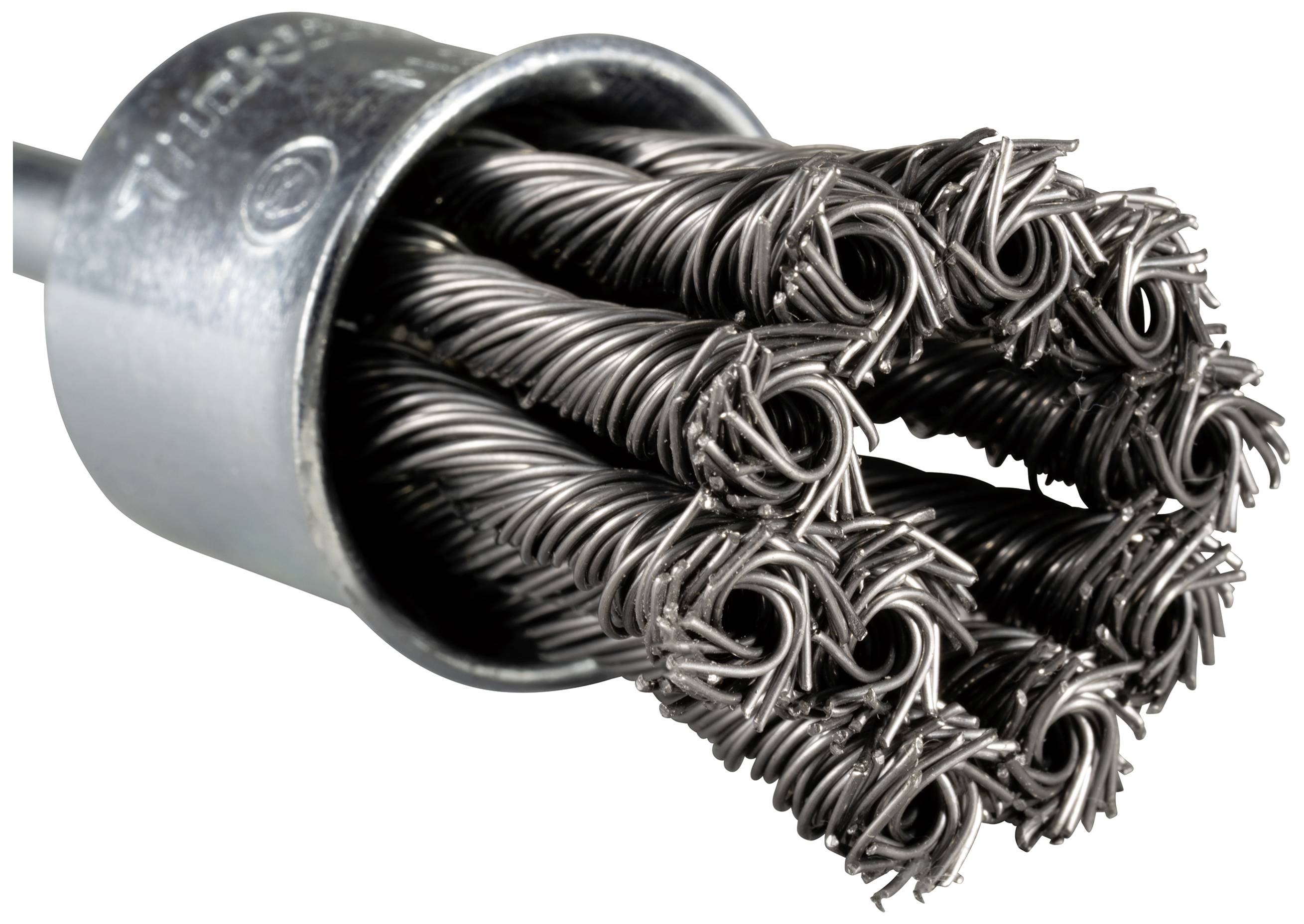 Close-up of a metal brush with wire-like bristles neatly arranged flush in a cylindrical holder.