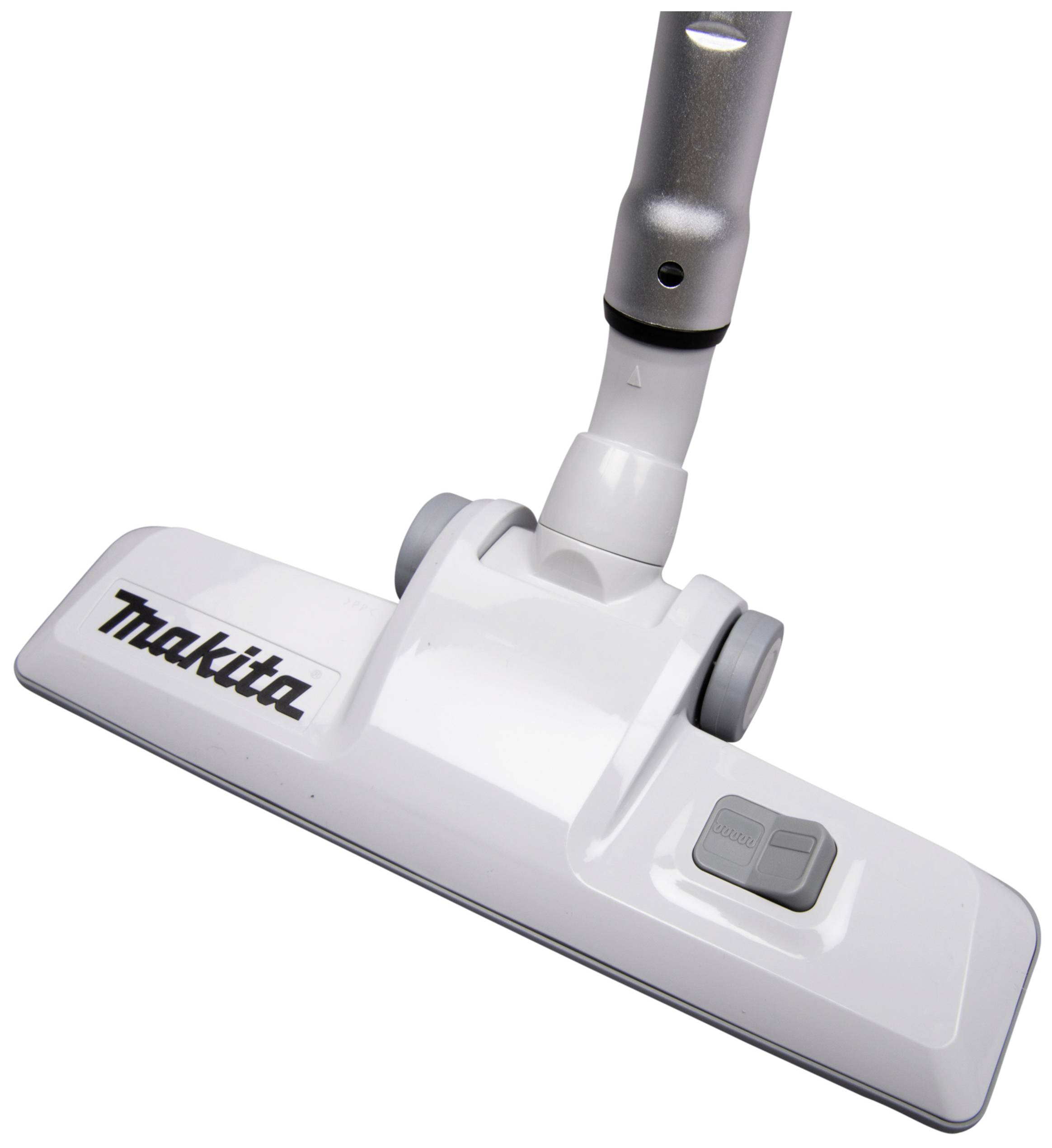 Vacuum cleaner nozzle viewed from above, with two rollers and the 'Makita' inscription, attached to a suction tube.