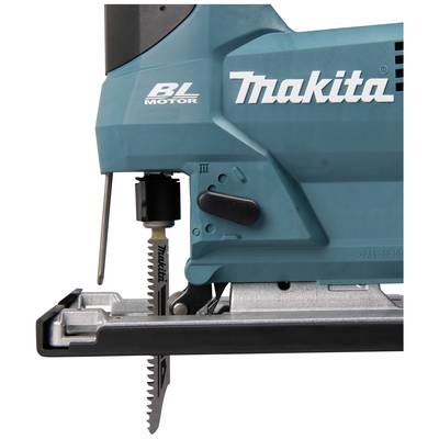 Teal-green electric jigsaw with a black handle and steel saw blade. Includes a tooth arrangement and operating switch.
