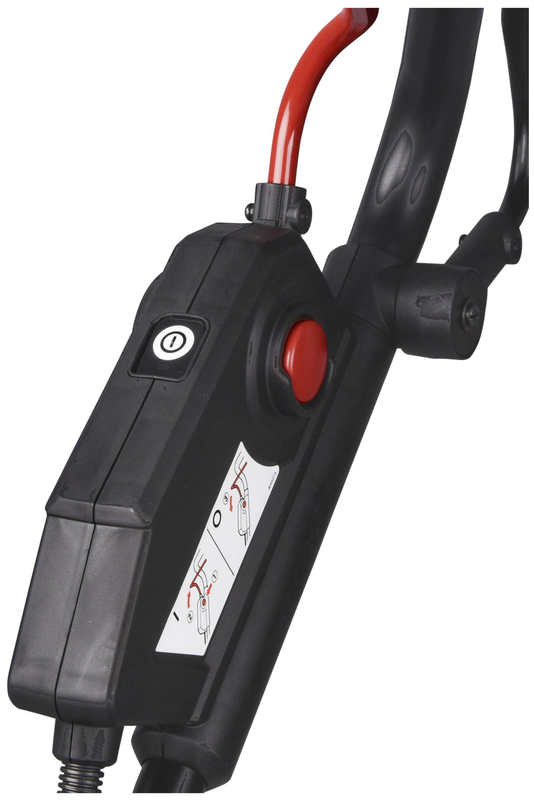 A black lever with a red button, connected with red and black cables. Instruction diagram with instructions visible.