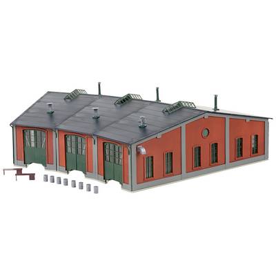 Red, four-doored locomotive depot model with green doors and windows. Accessories such as barrels and wall section are included.