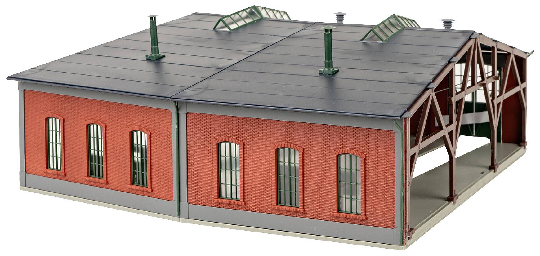 Two-storey model of a red brick locomotive shed with a grey roof and green vents. Open doors on the right-hand side.