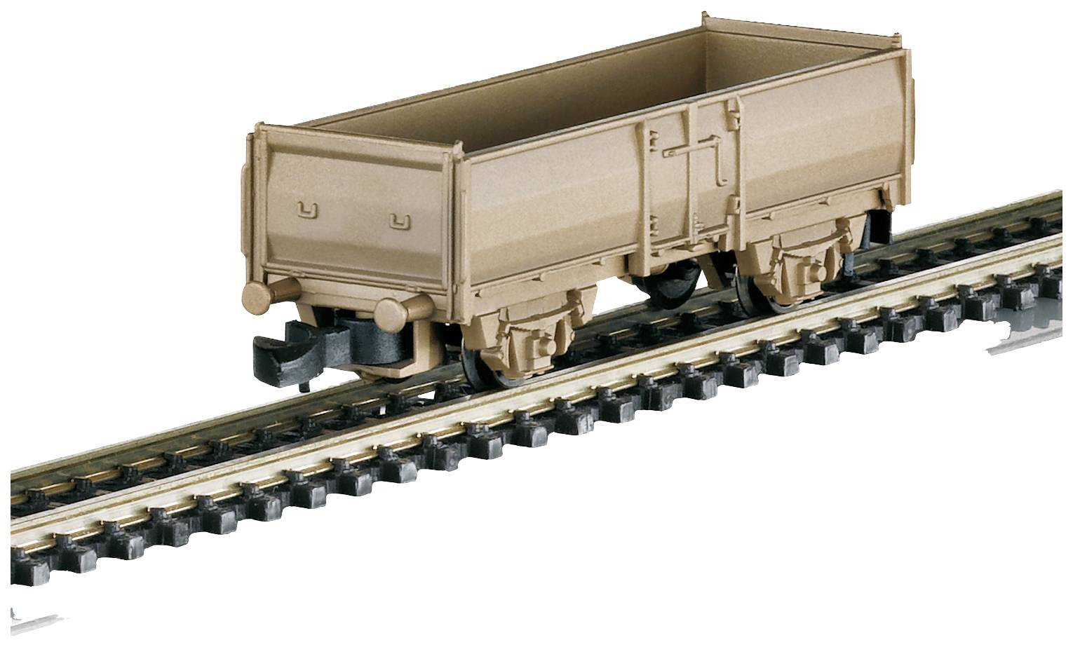 A brown model railway goods wagon on a section of track, detailed with wheel and coupling mechanisms.