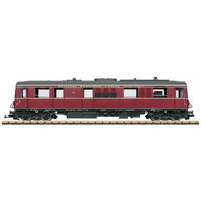 A red historical rail bus with windows and lettering 'Deutsche Reichsbahn-Gesellschaft' stands on railway tracks.