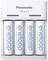 A Panasonic battery charger with four eneloop rechargeable batteries placed side by side.