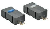 Two black electronic components with a rectangular shape, each with a coloured switch on top, blue on the left and grey on the right.