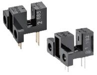 Two black optical sensors with three metal pins, used for electronic applications such as motion detection.