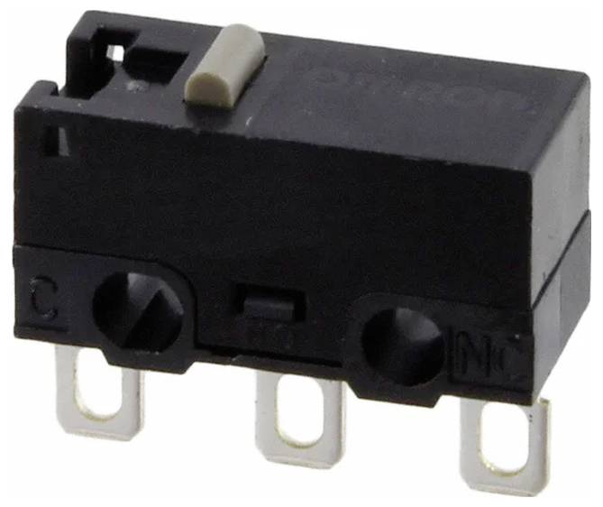A small black microswitch with three metal prongs and a white actuator on top.