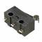 Small black micro switch with three terminal blocks and a metal lever for electrical devices.