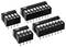 Four black DIP switches, each with 4 to 8 white toggle switches, numbered. They are intended for electronic configuration.