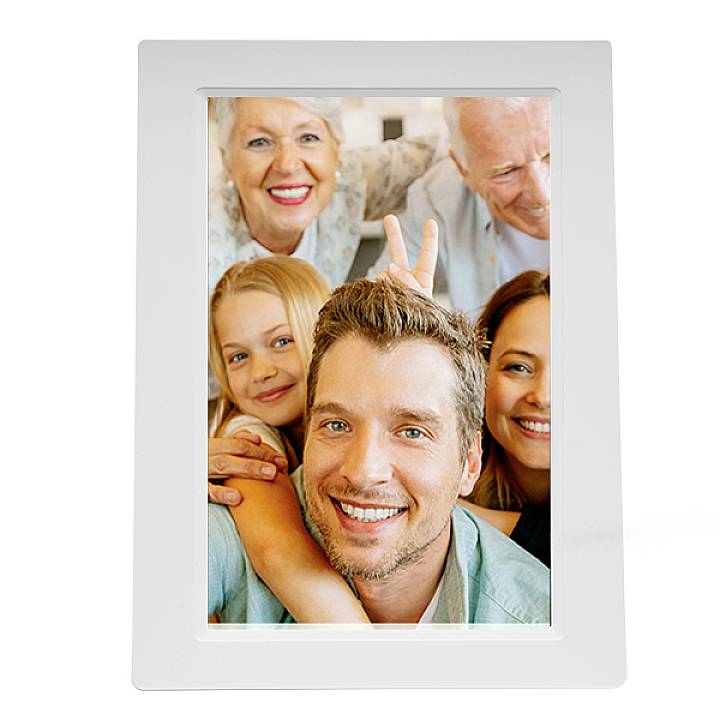 A smiling family: Two adults in the background, a man and a child at the front, with a woman beside them. Everyone appears happy and closely connected.