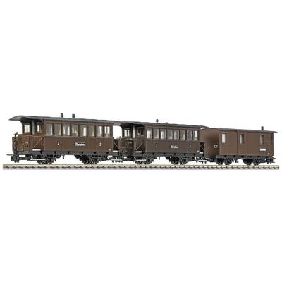 Three brown historic passenger carriages on a railway track. The carriages are numbered and have small windows.