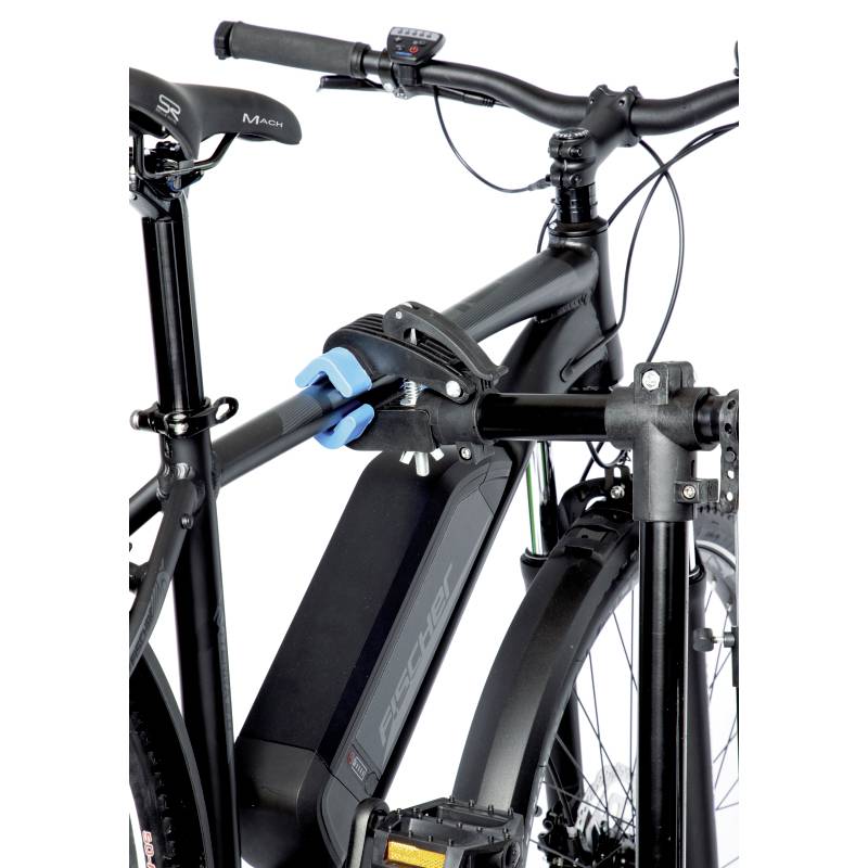 A black bicycle is positioned in a repair stand. A blue mechanism holds the e-bike by its frame.