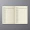 Open notebook on a grey background. Pages display budget tables with columns for month/year, details, and amount for income and expenses.