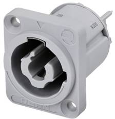 Grey, rectangular plug adapter with a round connection. Shows arrow symbols for correct orientation.