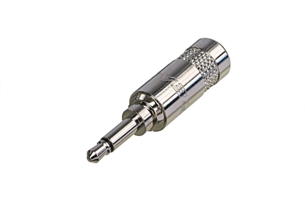 A silver 3.5-mm jack plug, commonly used for audio devices, lies on a white background.