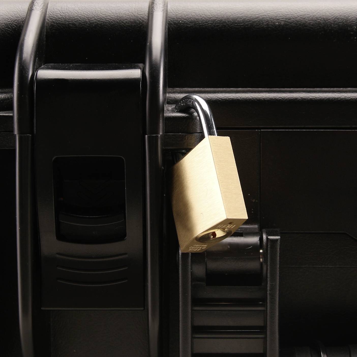 A gold-coloured padlock secures a black chest, symbolising safety and protection.