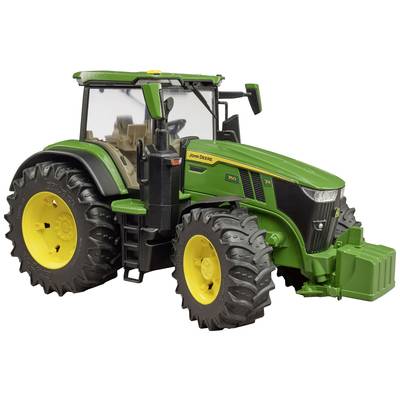 A green tractor with yellow wheels and a large driver's cab.