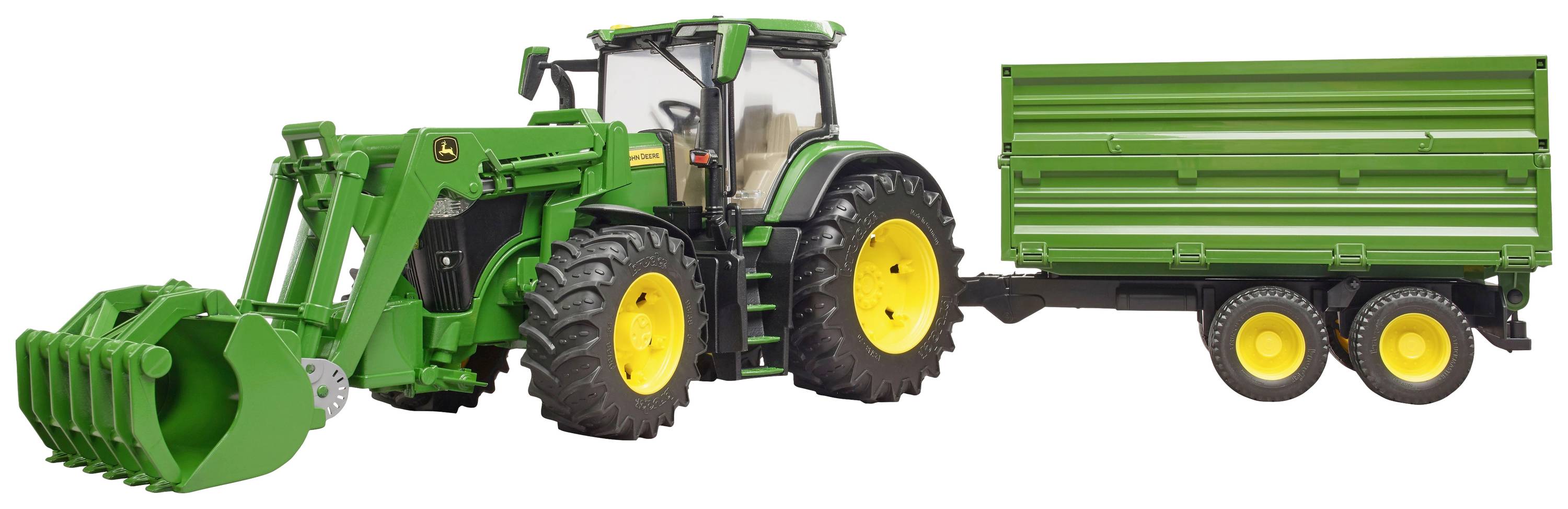 A green tractor with a front loader is pulling a green two-axle trailer. Both have yellow wheels.