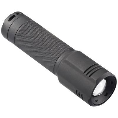 A black, cylindrical torch with a ridged grip surface lies at an angle. It has a lens at the front.