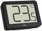 Digital thermometer displays '23.5 °C'. Black casing with large LCD display.<br><br>Note: In British English, temperatures are typically written with a period (.) instead of a comma (,) for decimal points, and the degree symbol (°) remains the same.