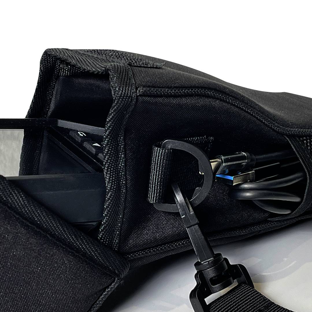 A black fabric bag showing a tech device with cables neatly stored inside.