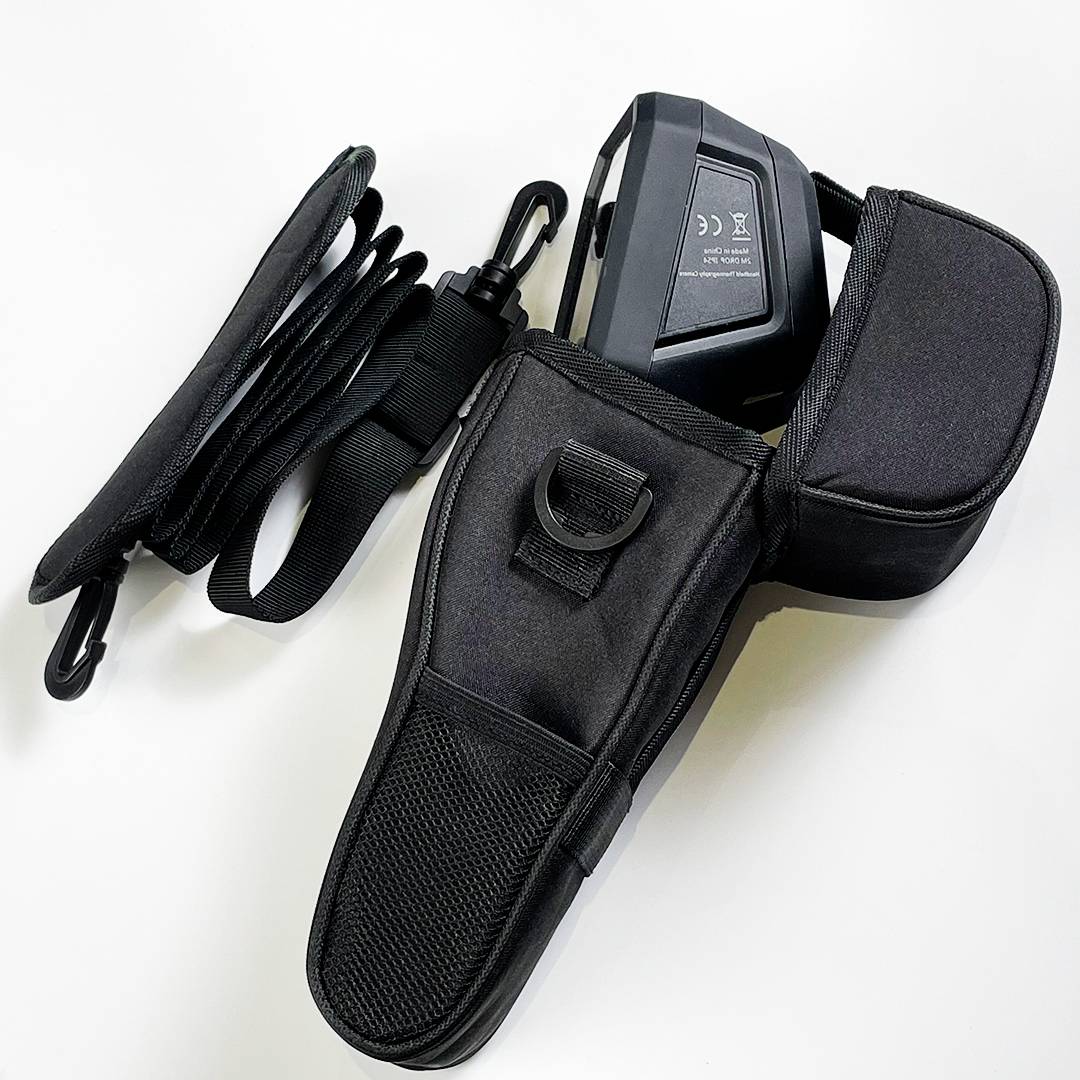 A black case with pockets, carrying loop, and device attached. The setup looks suitable for portable tech accessories.