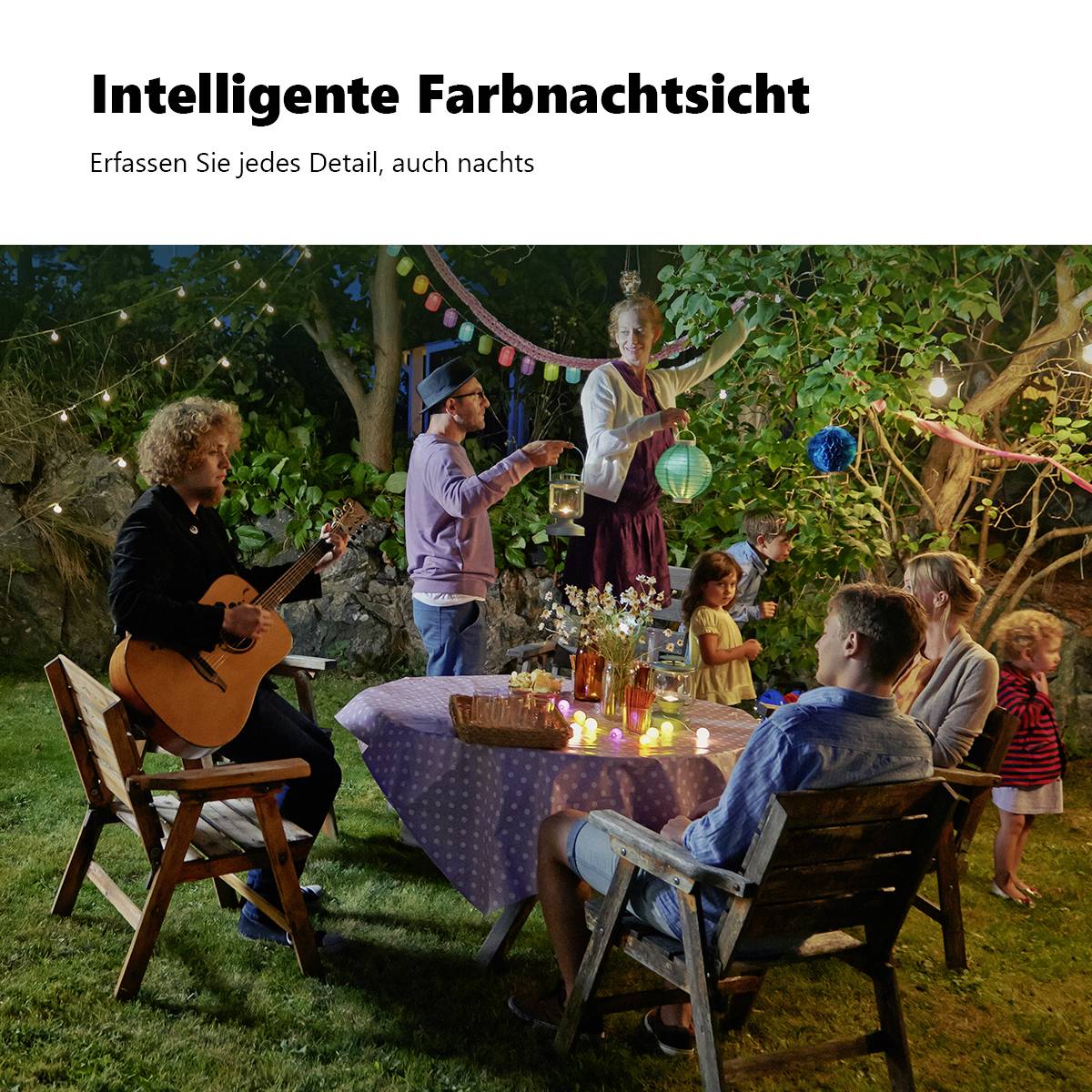 A garden party at night with music and lights. People are sitting and standing around a table, some chatting, others enjoying the atmosphere.