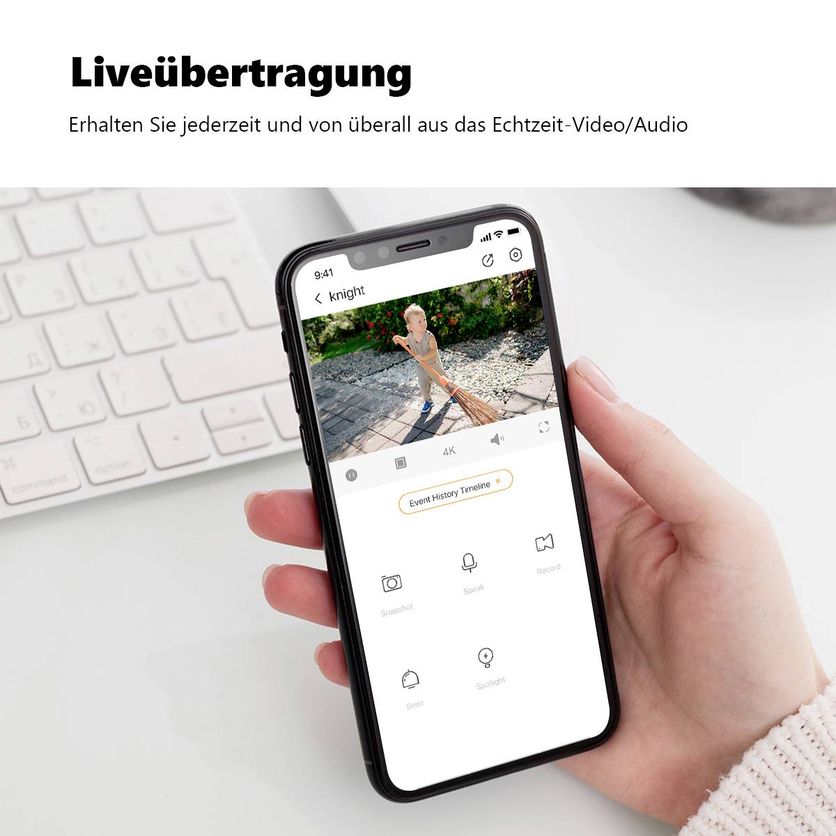 A person is holding a smartphone with a surveillance app open, with the text 'Live Streaming' underneath.