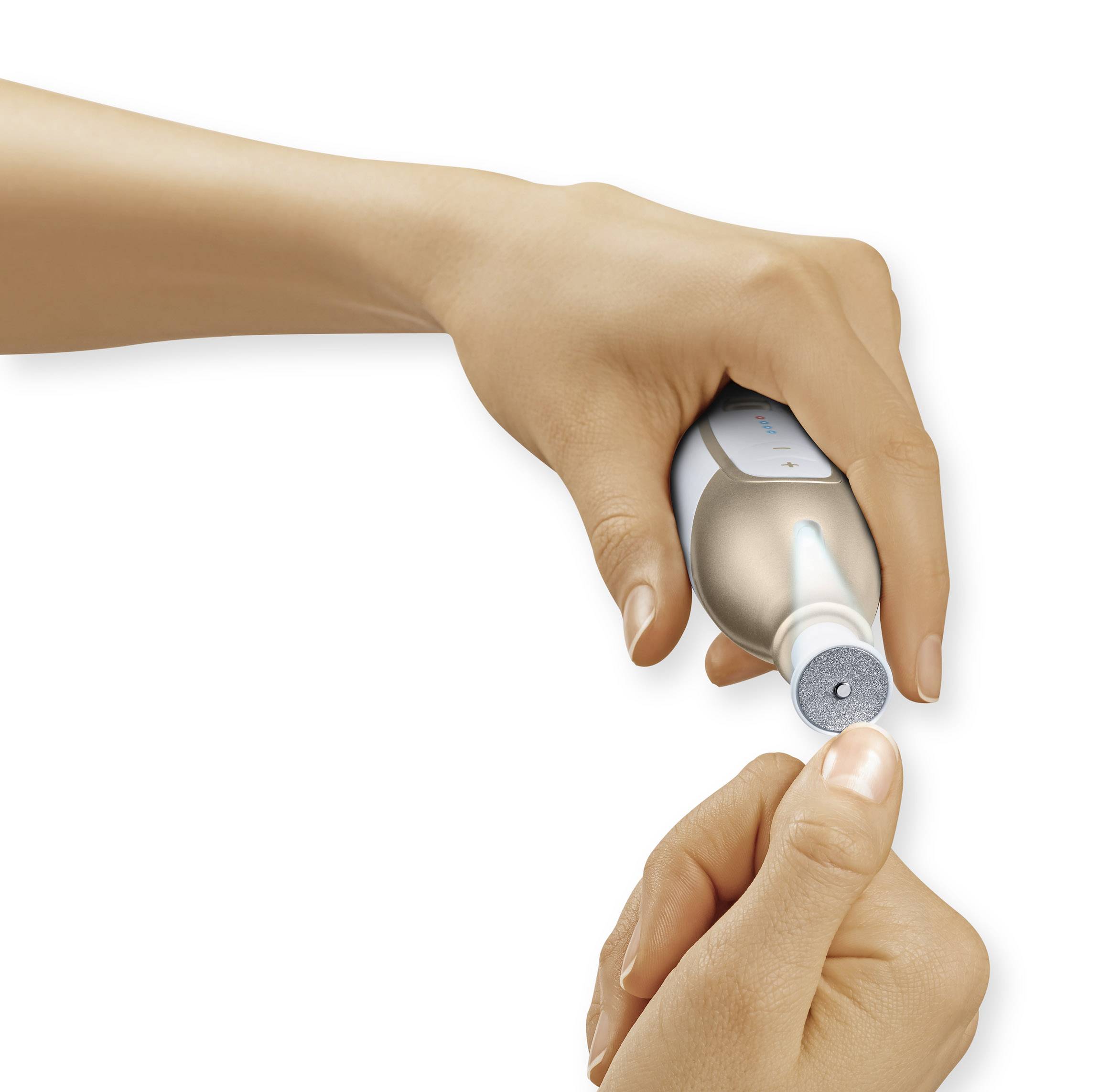 A hand squeezes toothpaste onto a toothbrush.