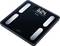 Black digital scale with silver sensor plates displays a weight of 62.4 kg. Brand 'Beurer' visible on the display.