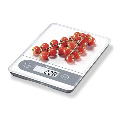 A kitchen scales shows 228 grams. Red cherry tomato vine clusters are resting on the scales.