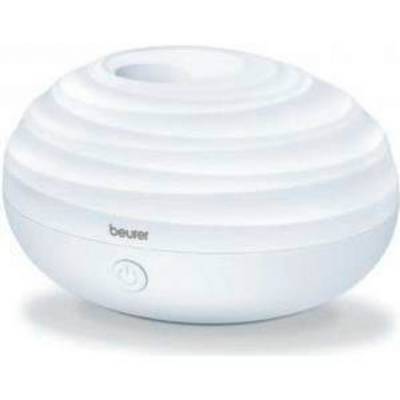 A round, white humidifier with a ribbed surface and a central outlet. The brand name 'beurer' is displayed on the front.