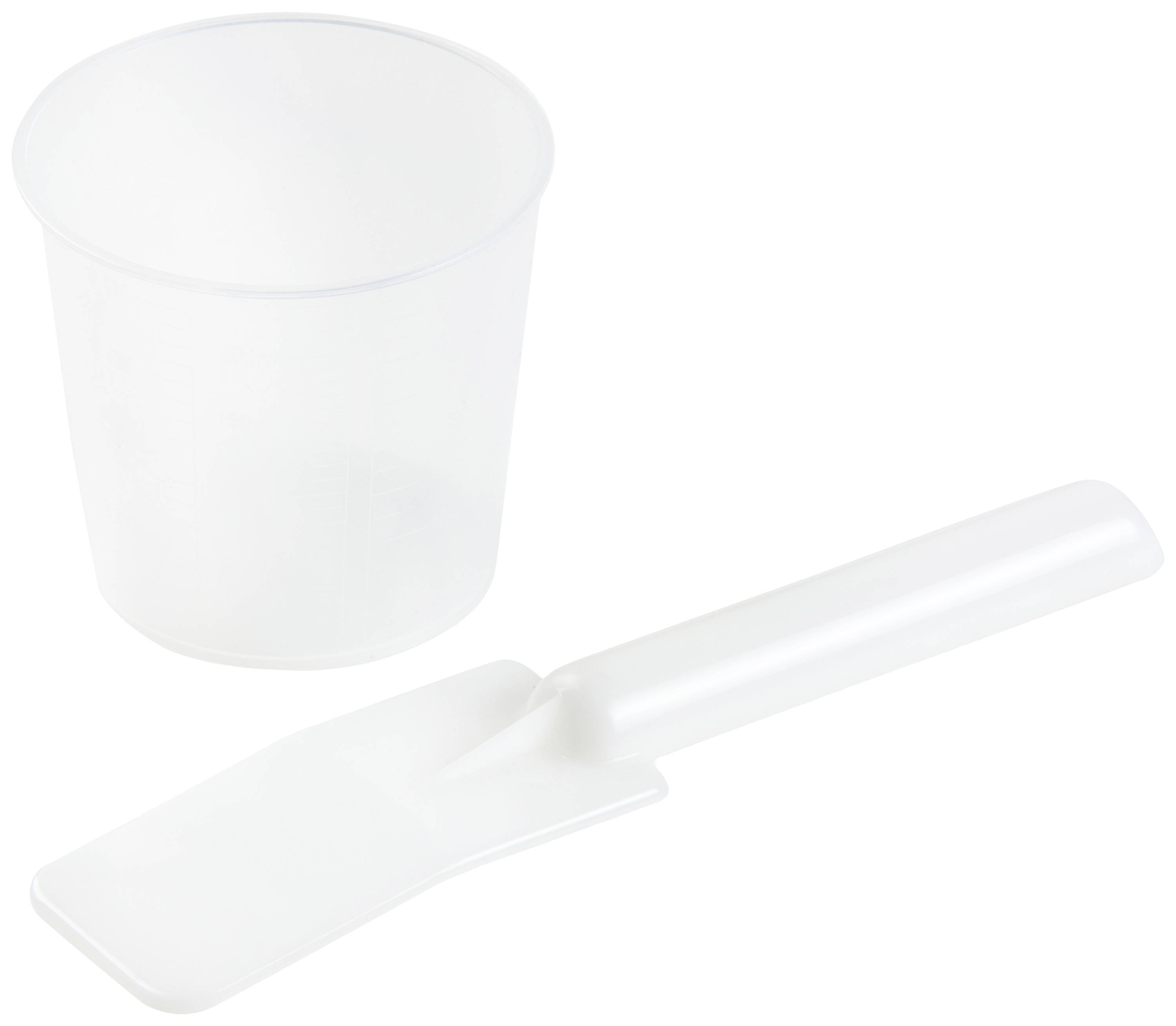 A transparent plastic cup and a white plastic spade are lying next to each other.