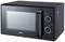 Black microwave with two rotary knobs for setting time and power. Visible brand 'DOMO'.