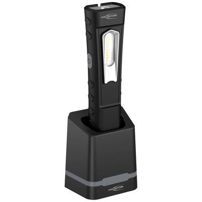 Black LED stick lamp in charging station, vertically positioned. Power button located on the lamp. Brand name visible at the top.