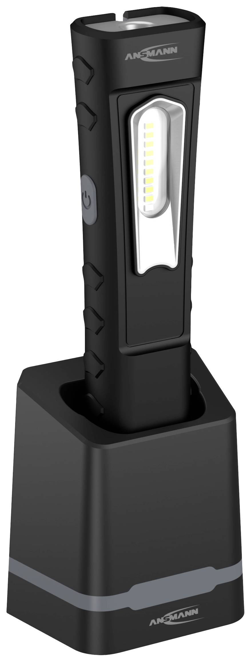 A black, vertical LED torch stands in a charging station. It has a slim design and a side power button.
