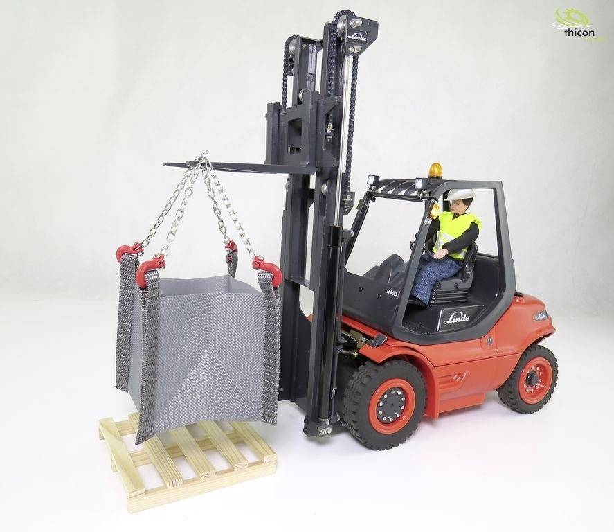 A red forklift is lifting a large metal crate on a pallet. The driver is wearing a yellow high-visibility vest and a white hard hat.