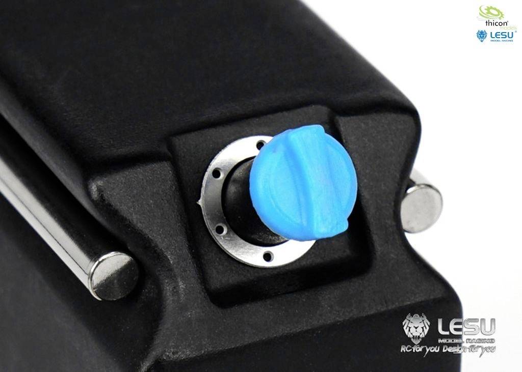 Black mechanism with a round, blue rotary knob in the centre, brand logos in the top right and bottom right.