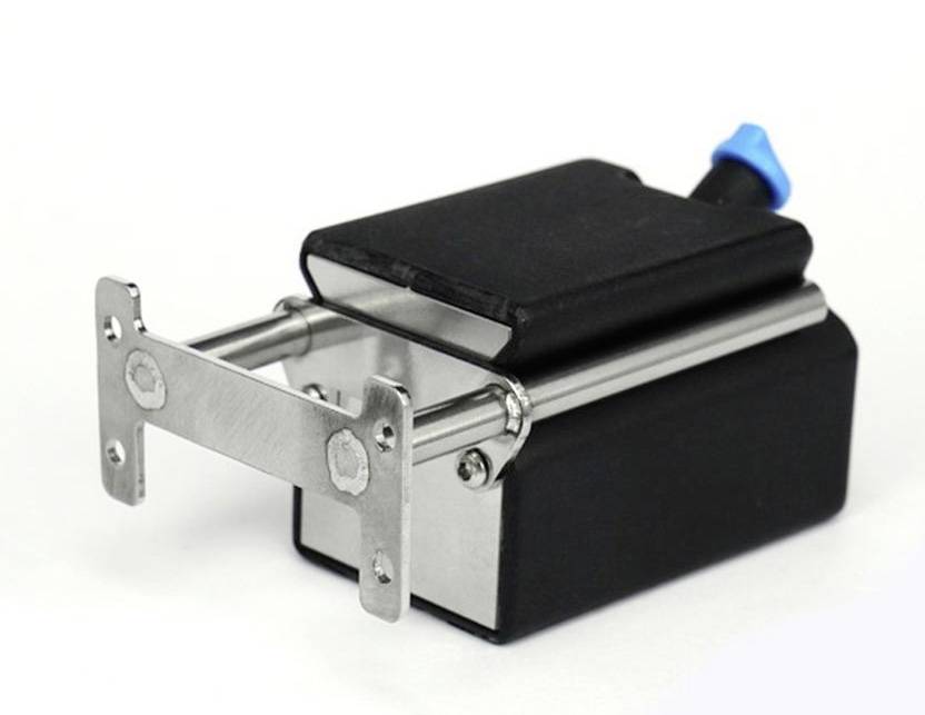 A small, rectangular black motor with two protruding metal rods and a blue control button.