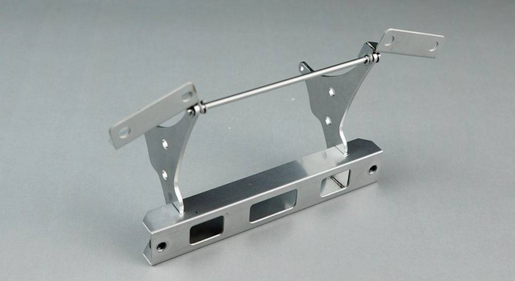 Metal frame with movable parts, likely designed as a mount or fastening. Two arms are attached to a crossbar.