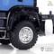 Close-up of a blue model lorry with visible tyre and Lesu logo. Detailed representation of the wheel construction.