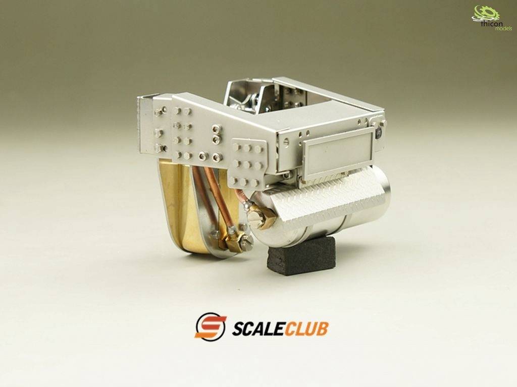 A silver, metallic model part with complex components and screws, placed on a small black base, featuring the 'Scale Club' logo.