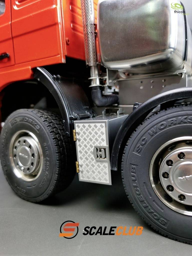 Close-up of a red lorry with a large fuel tank and tyres. Beneath it, the logo 'SCALECLUB'.