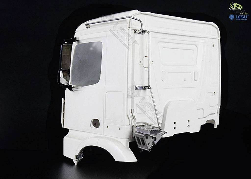 White lorry cab against a black background. It shows details such as door, window and mirror, without wheels or chassis.