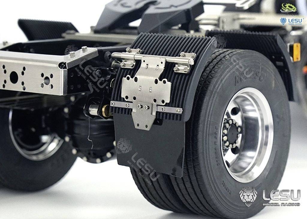Rear wheel and axle of a lorry model, detailed view of mechanical components and tyre structure.