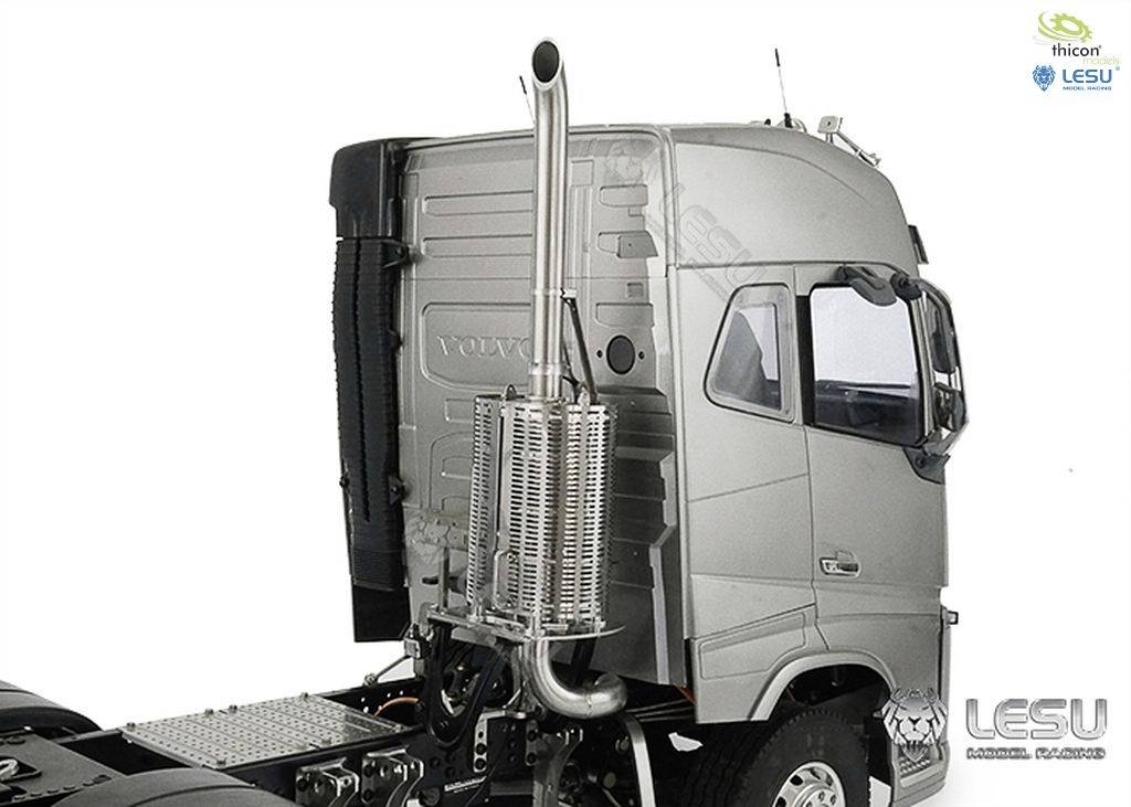 Grey model lorry with chrome-plated exhaust pipe, distinctive cab and Lesu and Thicon logos at the edge of the image.