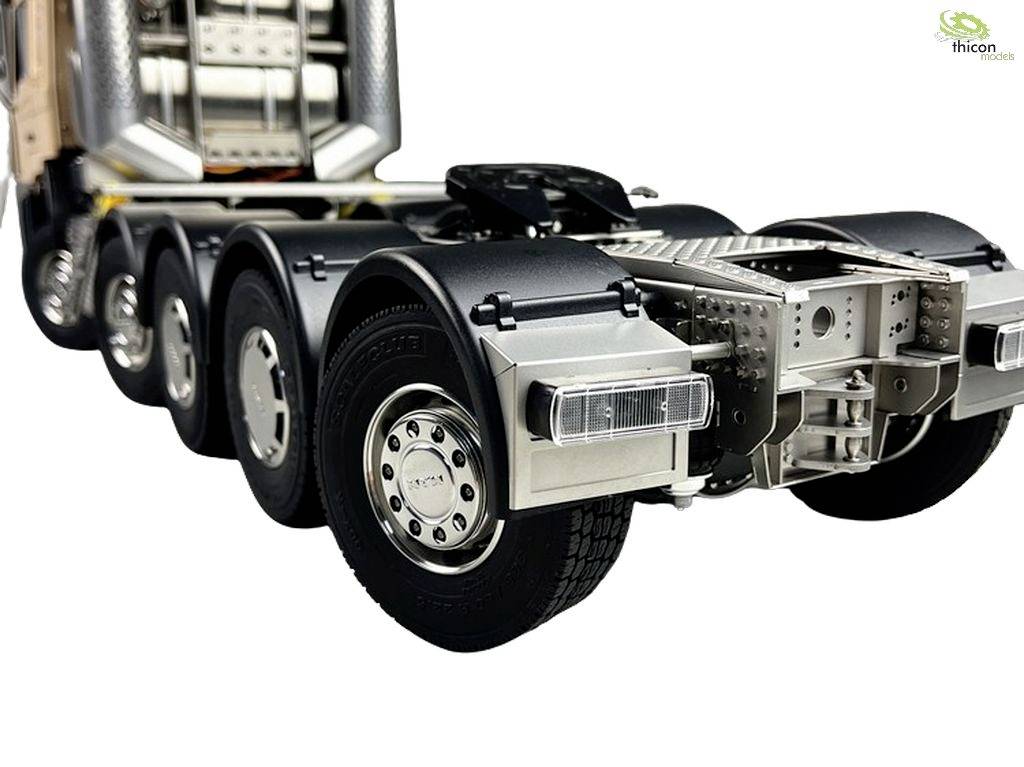 'Metal lorry chassis with multiple axles. Detailed view shows tyres and suspension. Company logo top right: Thicon Models.'