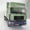 Green MAN F2000 lorry, photographed from the front, on a white background. Transport vehicle, possibly a model or toy.