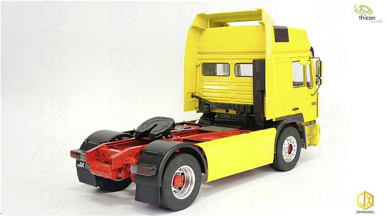 Yellow model of a lorry without a trailer, side view, on a white background. It demonstrates the construction and structure of the vehicle.